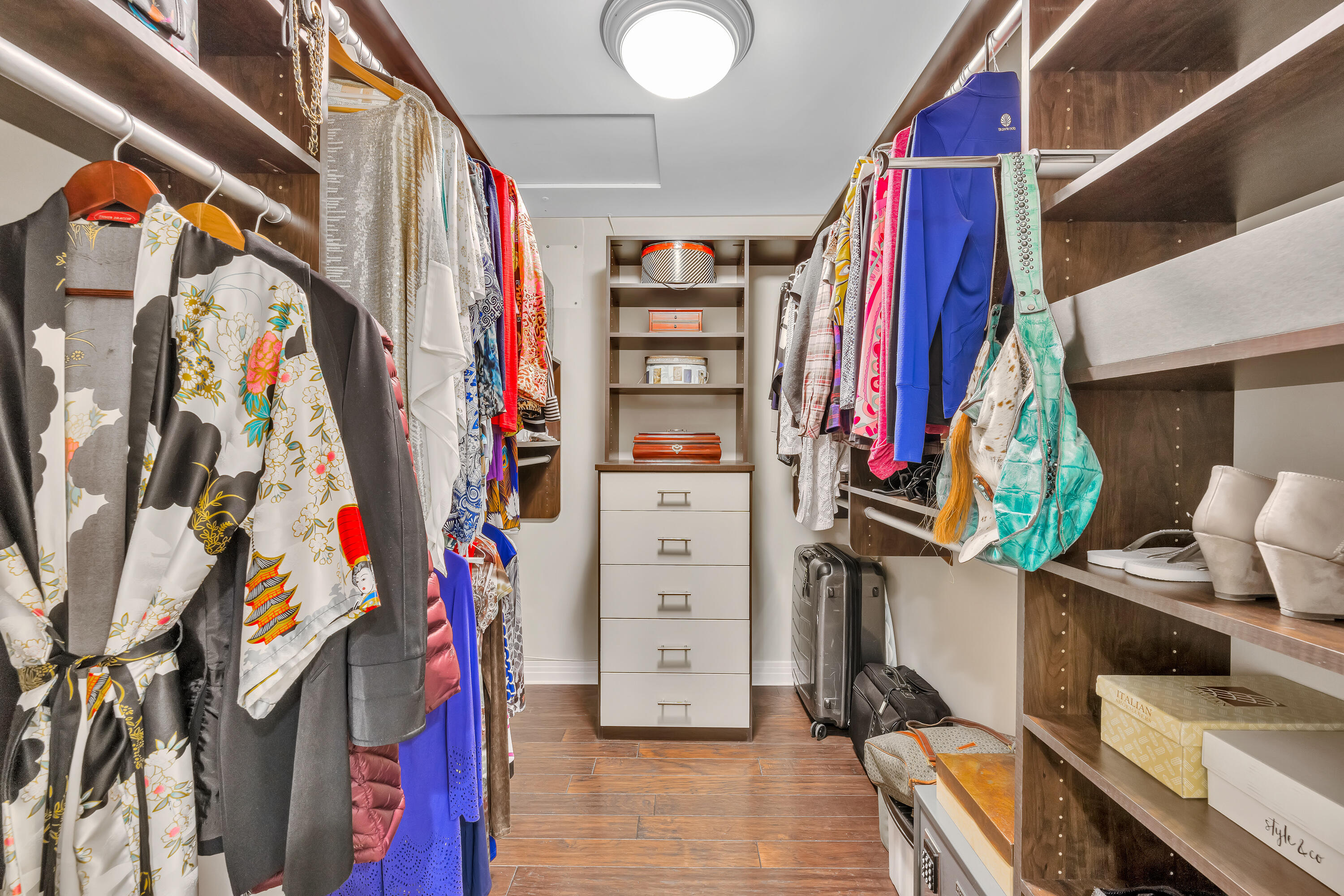 73005 Haystack Road Palm Desert, CA 92260 - Photo 30 of 45 a view of walk in closet with clothes and shoes