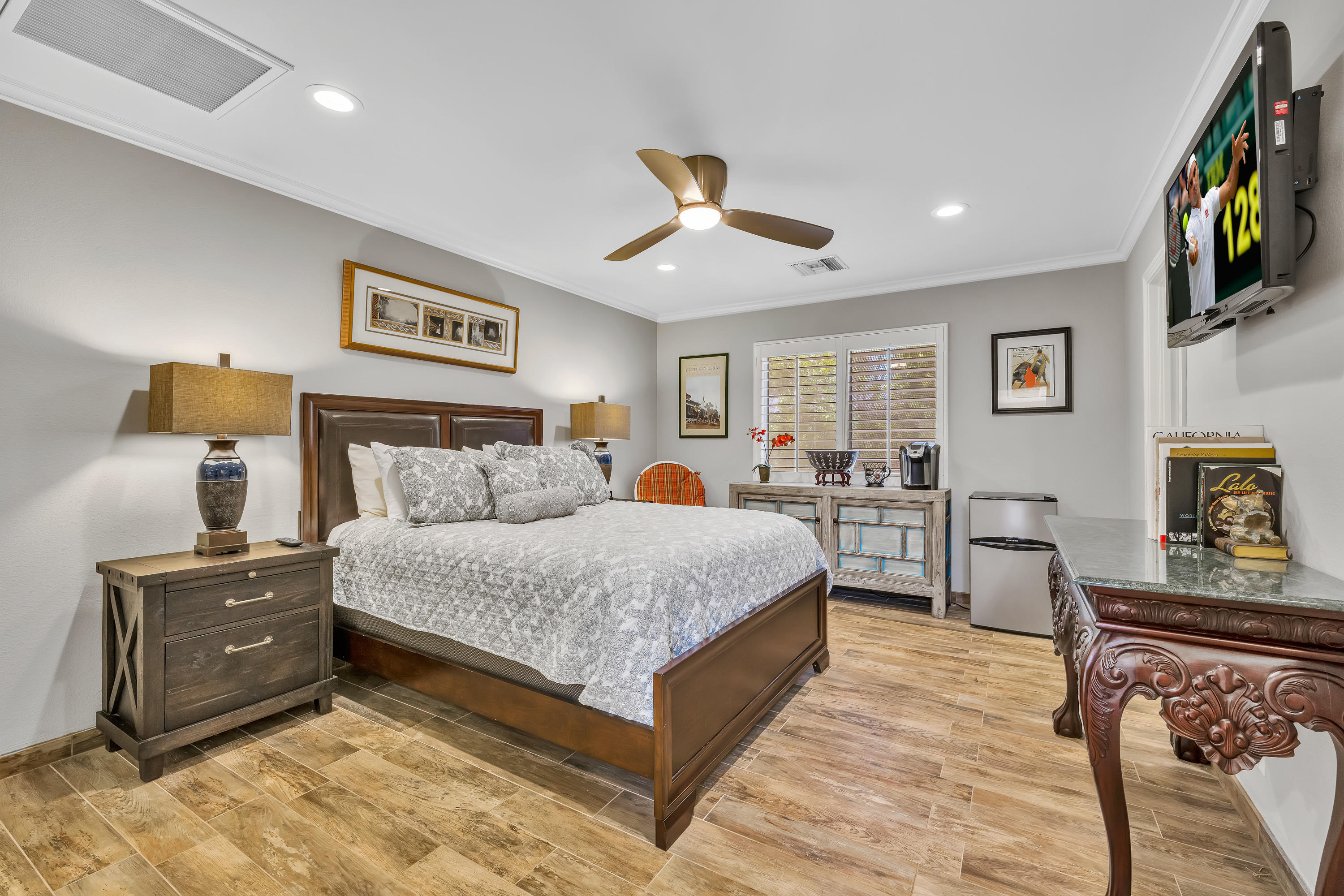 73005 Haystack Road Palm Desert, CA 92260 - Photo 33 of 45 a bed room with bed and painting on the wall