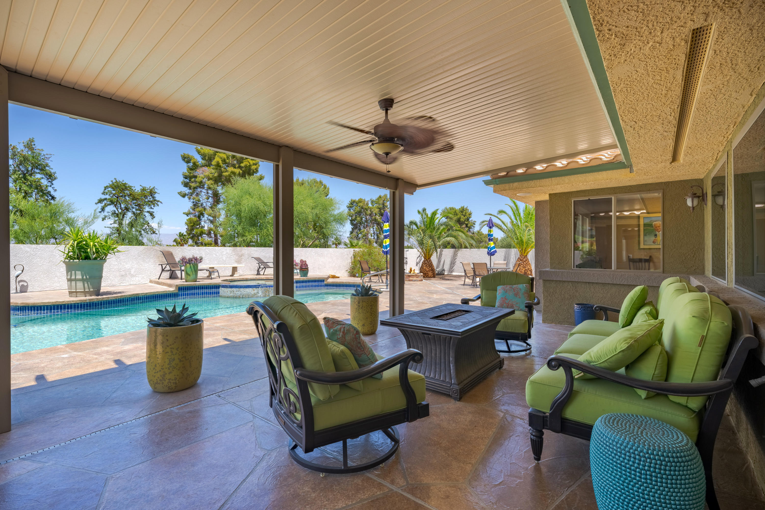 73005 Haystack Road Palm Desert, CA 92260 - Photo 38 of 45 a living room with patio furniture and a floor to ceiling window