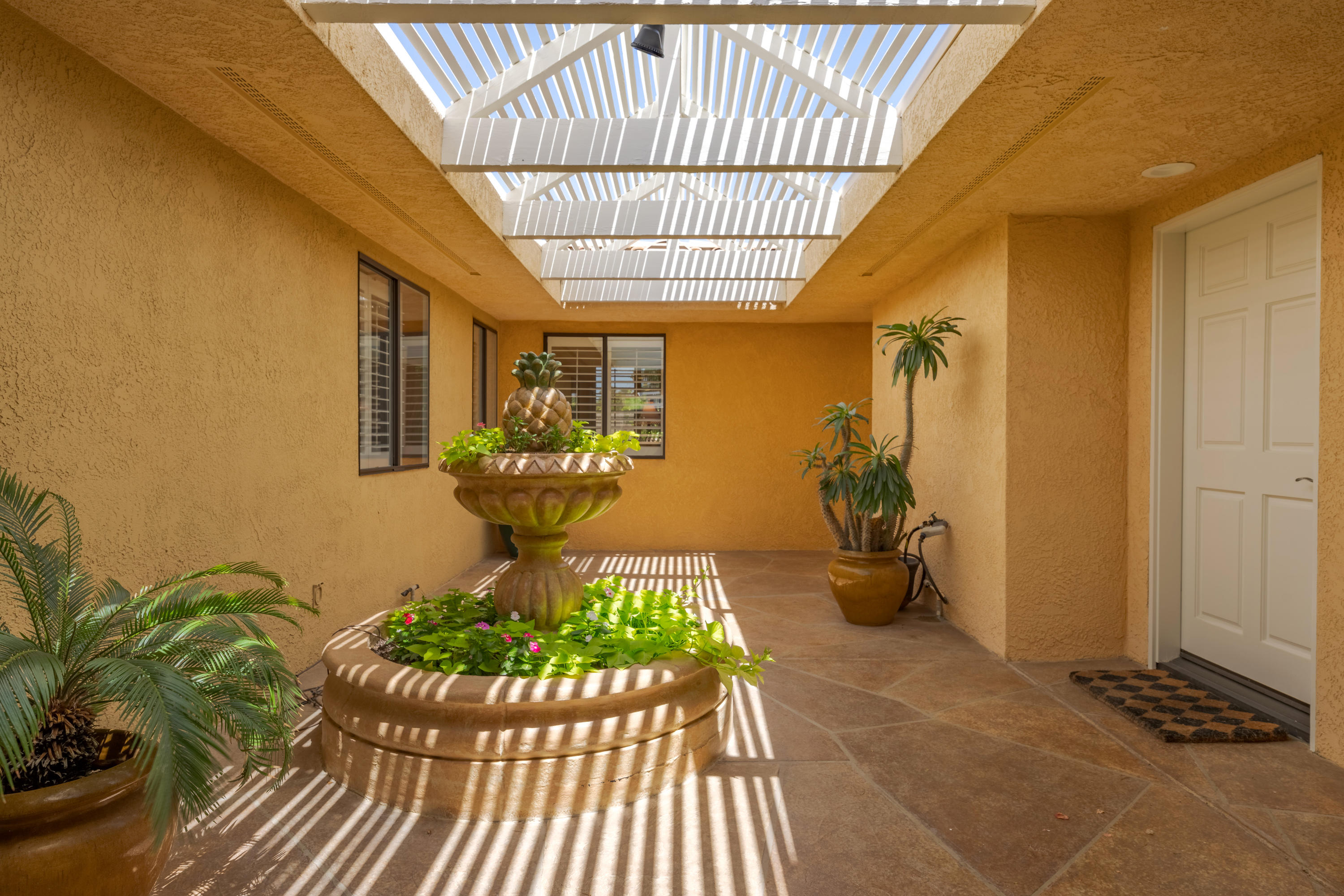 73005 Haystack Road Palm Desert, CA 92260 - Photo 8 of 45 a view of a entryway door the house