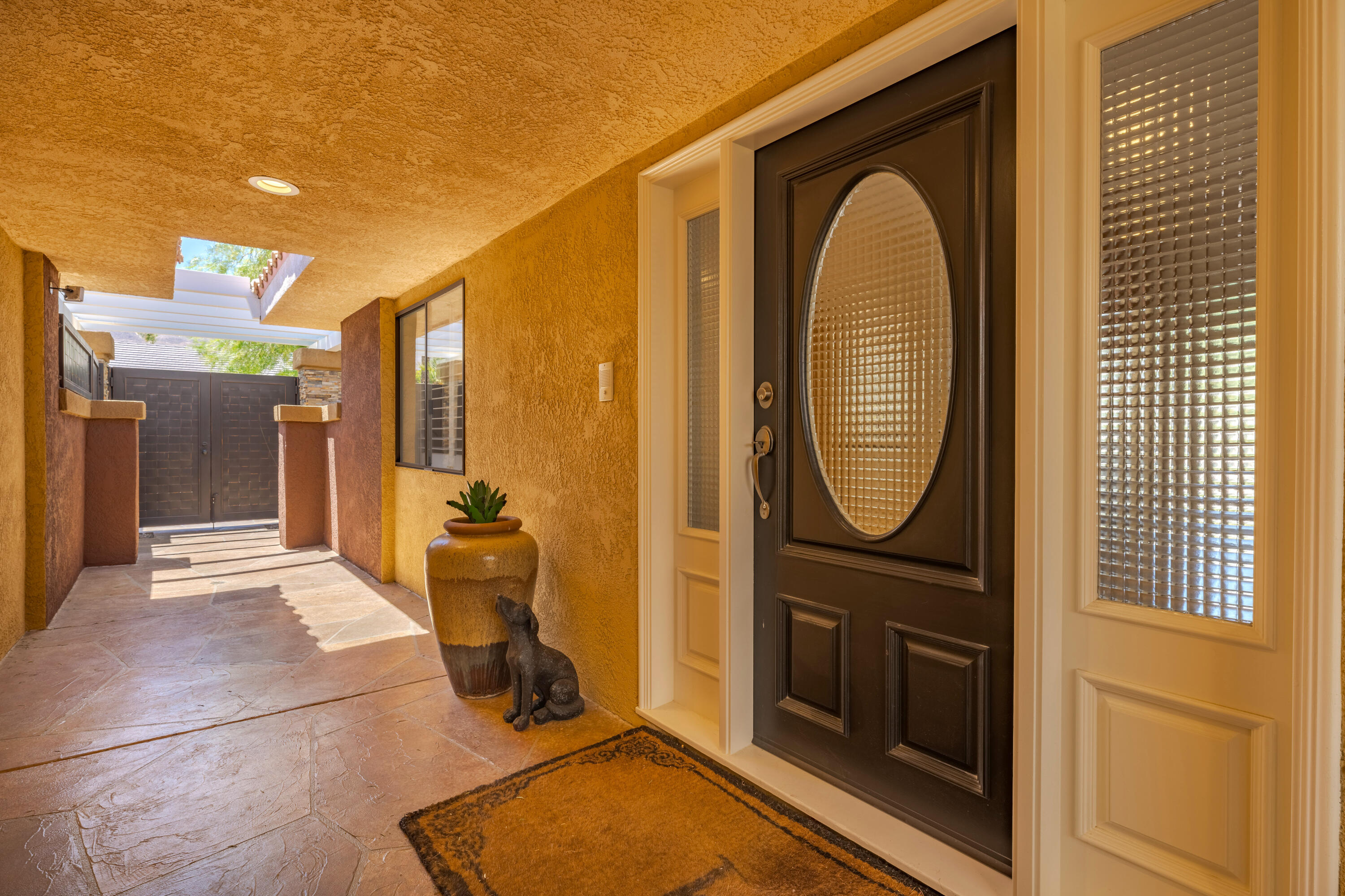 73005 Haystack Road Palm Desert, CA 92260 - Photo 9 of 45 a view of a entryway door front of a house