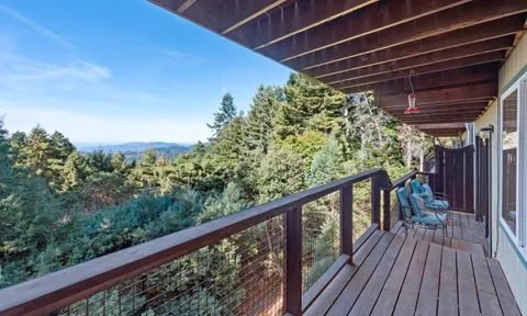 a view of a balcony with wooden floor