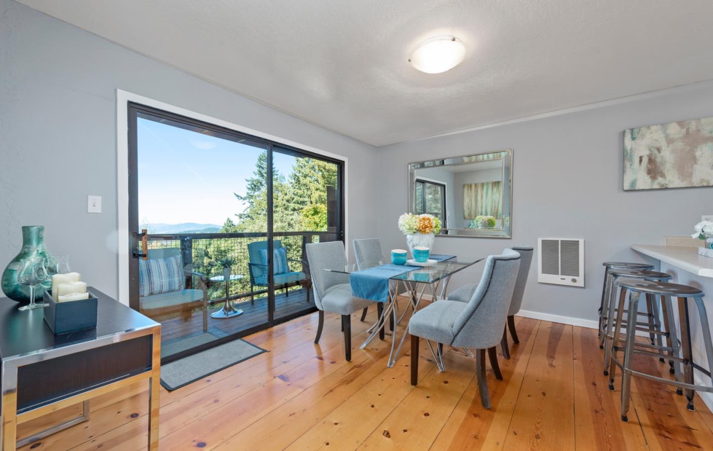 14826 Skyline Boulevard, Unit 3 Woodside, CA 94062 - Photo 4 of 13 a view of a dining room with furniture and a potted plant