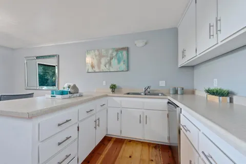 a kitchen with a sink and cabinets