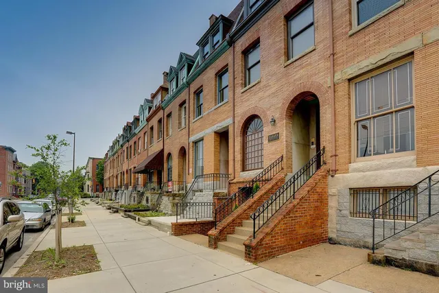a front view of a building with many windows