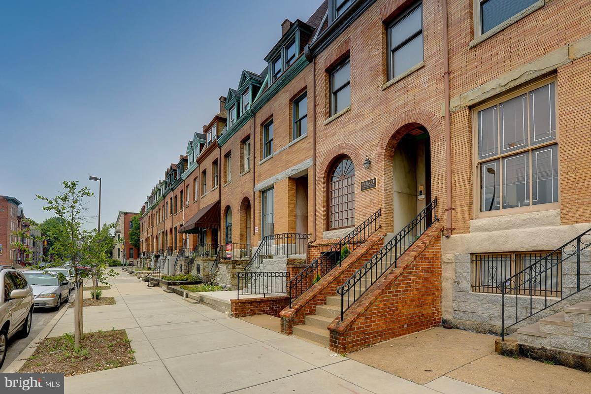 1609 St Paul Street Baltimore, MD 21202 - Photo 6 of 6 a front view of a building with many windows