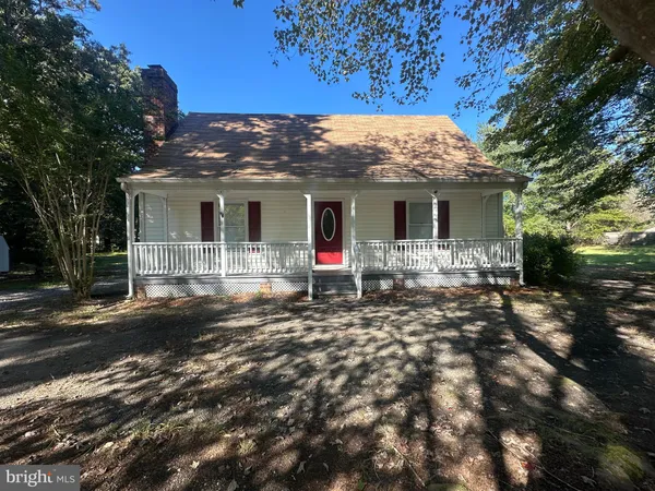 a view of house with yard