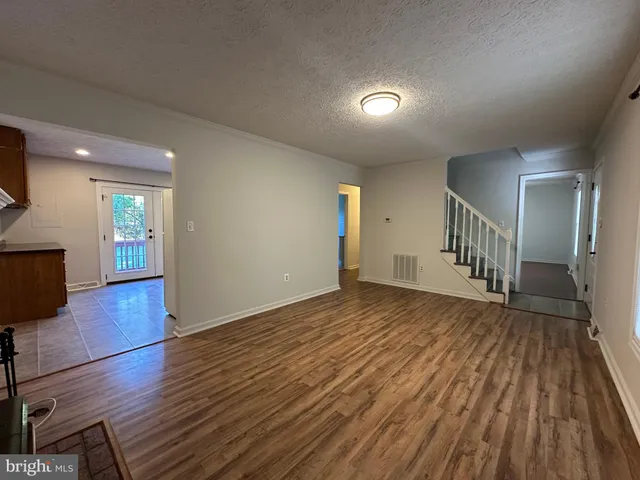 a view of a livingroom with wooden floor