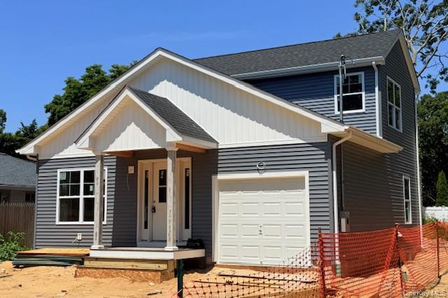 111 Eleanor Avenue Mastic, NY 11950 - Photo 1 of 1 a front view of a house with a yard
