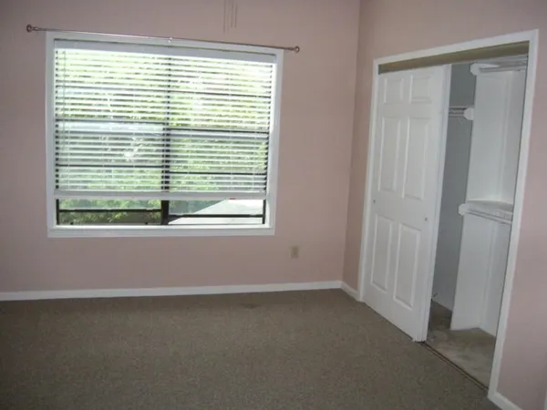a view of a room that has a window in it