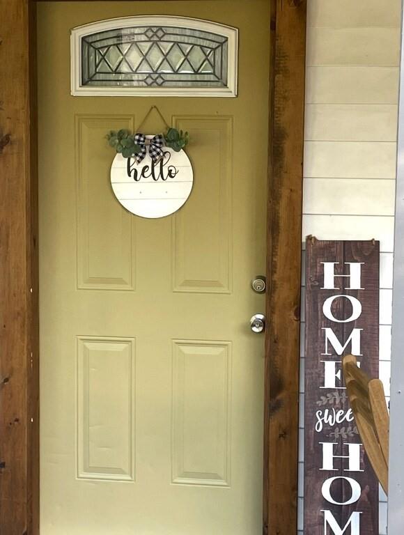 a view of a door and a kitchen