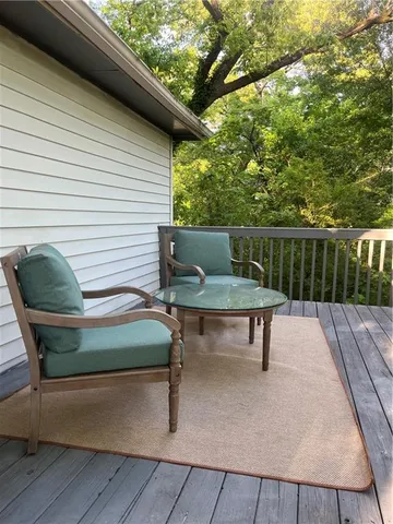 a white bench sitting in front of a house