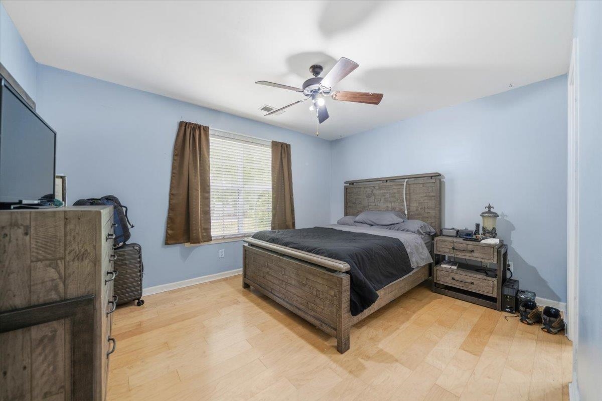 7226 Cedar Road Bartlett, TN 38135 - Photo 19 of 29 a bedroom with a bed dresser and a window
