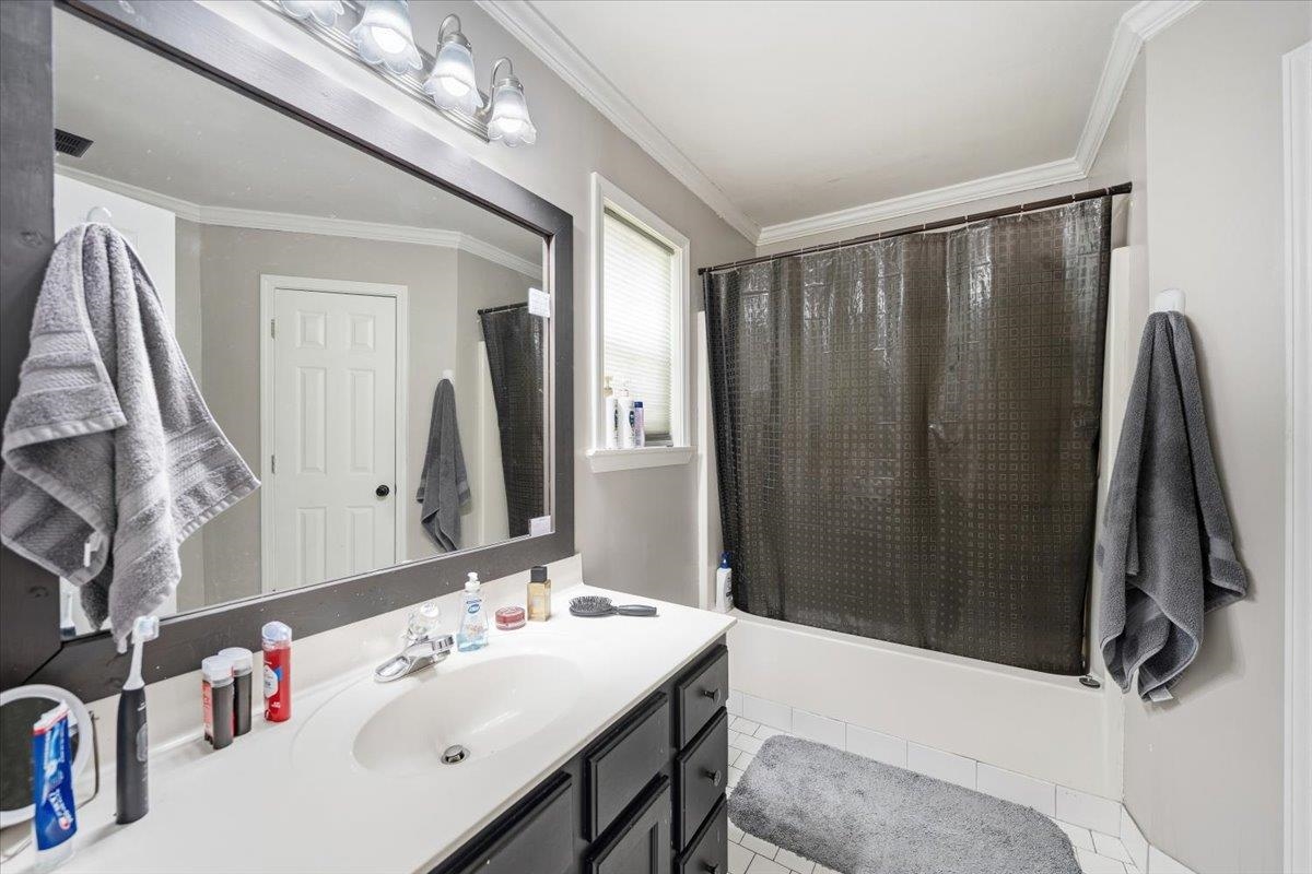 7226 Cedar Road Bartlett, TN 38135 - Photo 20 of 29 a bathroom with a sink vanity and a mirror