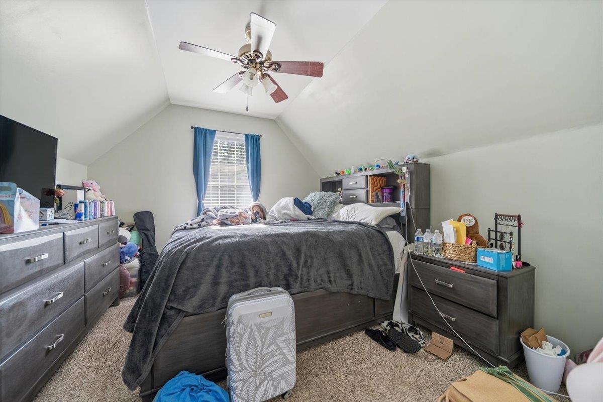 7226 Cedar Road Bartlett, TN 38135 - Photo 22 of 29 a bedroom with a bed and a chandelier