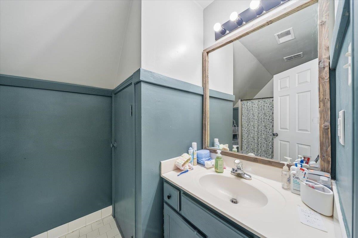 7226 Cedar Road Bartlett, TN 38135 - Photo 23 of 29 a bathroom with a sink and a mirror