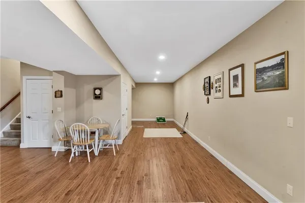 a view of a livingroom with furniture and wooden floor