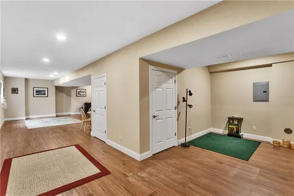 a view of a livingroom with wooden floor and a couch