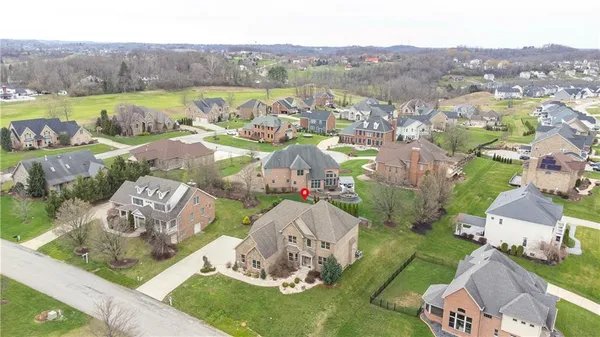an aerial view of a residential houses and outdoor space