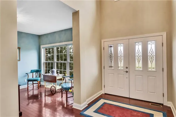 a view of a livingroom with furniture and hardwood floor