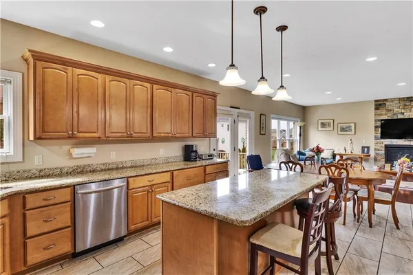 a kitchen with center island table and chairs in it