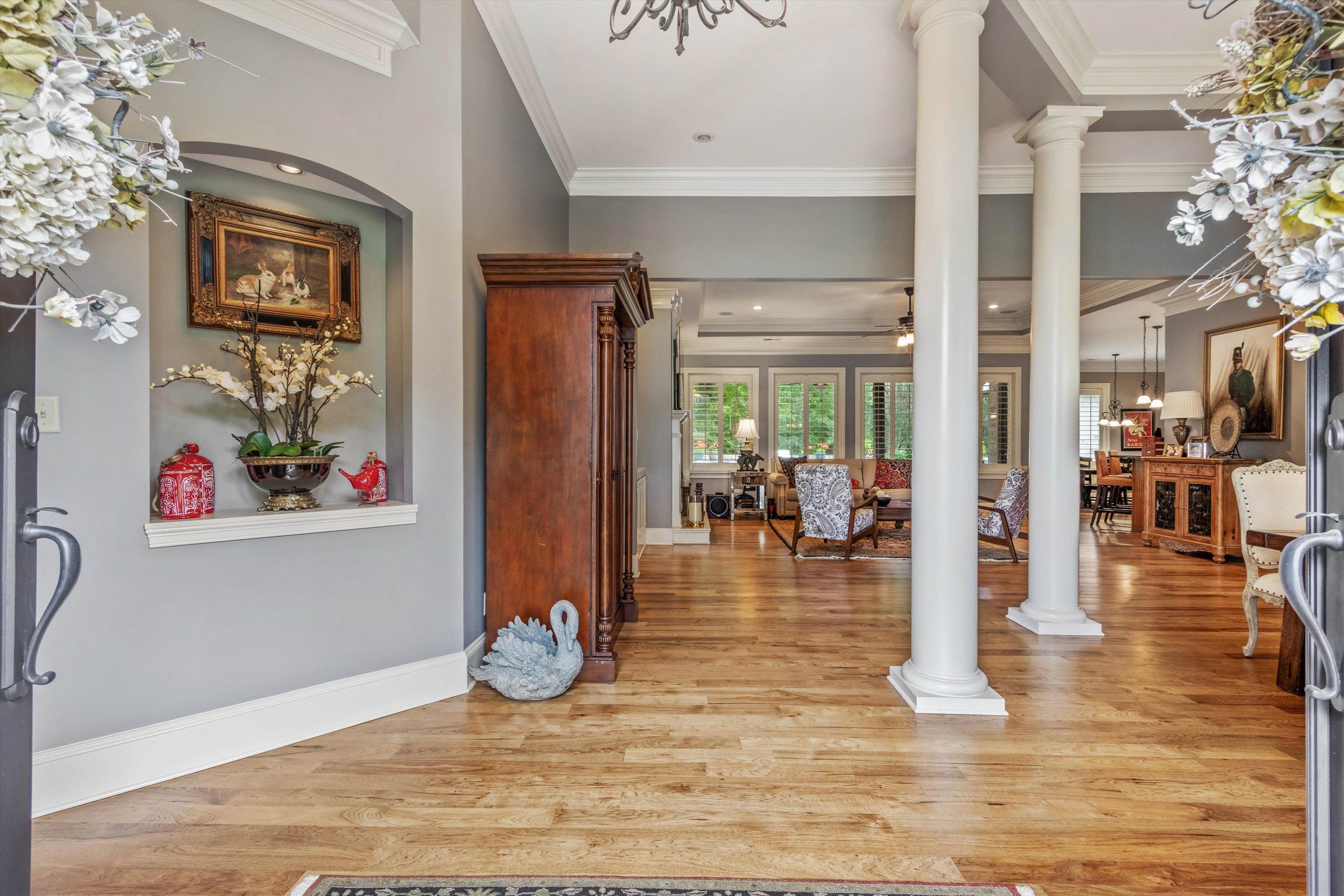 150 Ridgecrest Drive Arlington, TN 38002 - Photo 5 of 40 Entry foyer featuring hardwood flooring and architectural columns