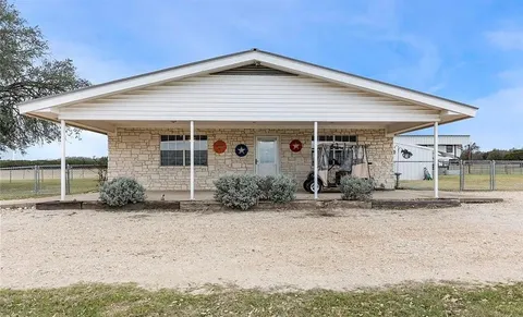 a view of a yard in front of the house