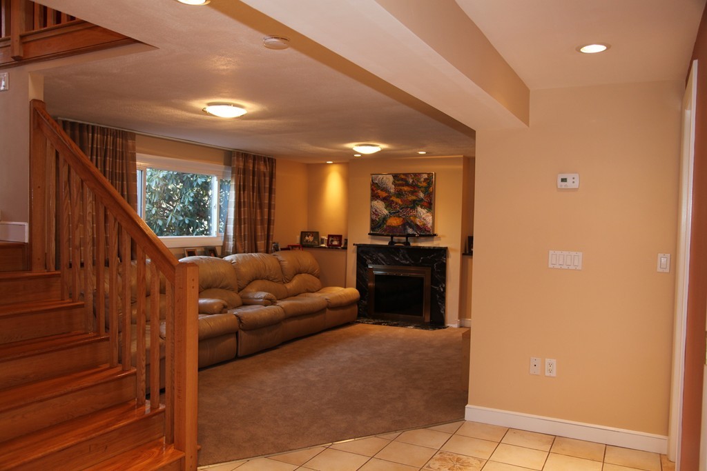 155 Noanett Road Needham, MA 02494 - Photo 11 of 18 a living room with furniture and a large window