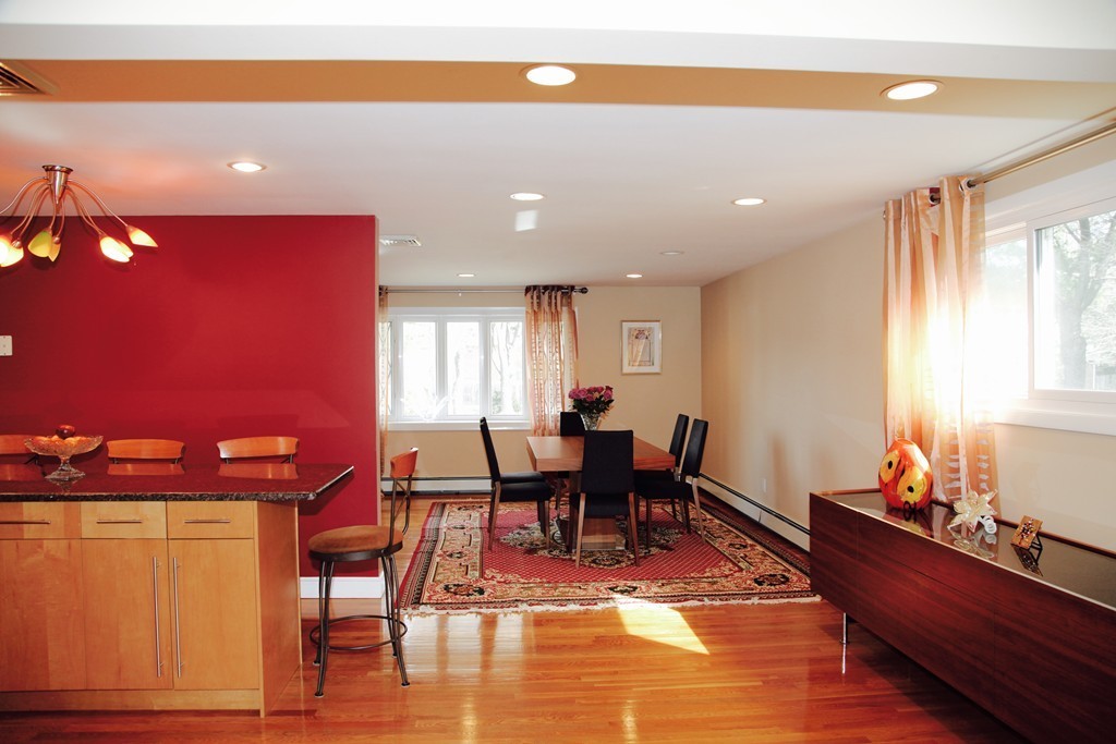 155 Noanett Road Needham, MA 02494 - Photo 3 of 18 a view of a dining room with furniture and chandelier