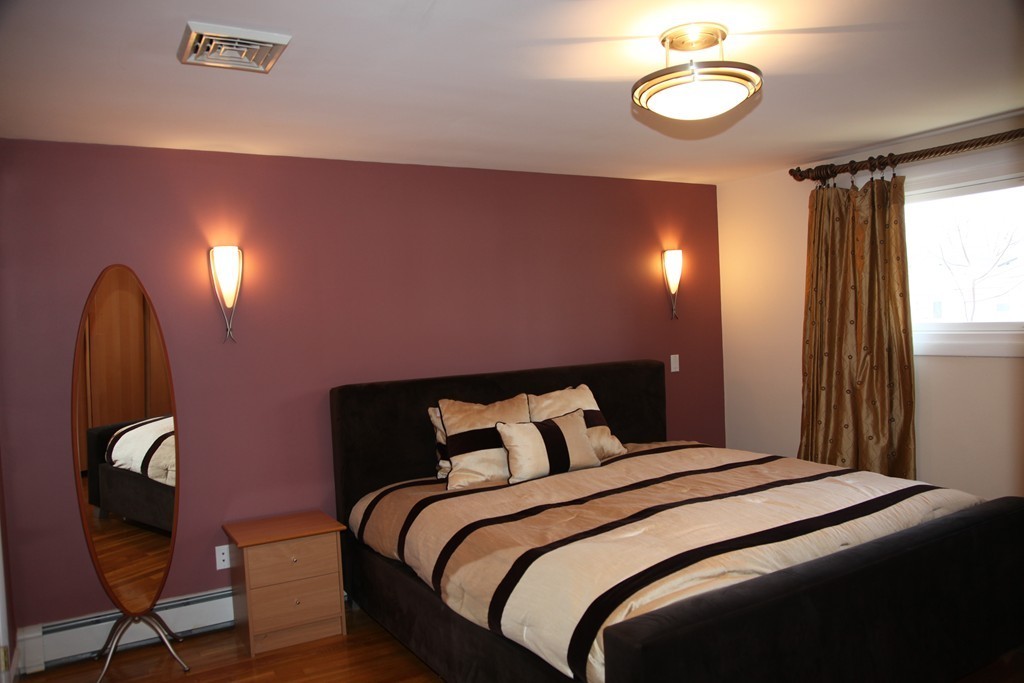 155 Noanett Road Needham, MA 02494 - Photo 5 of 18 a bedroom with a bed and a chair