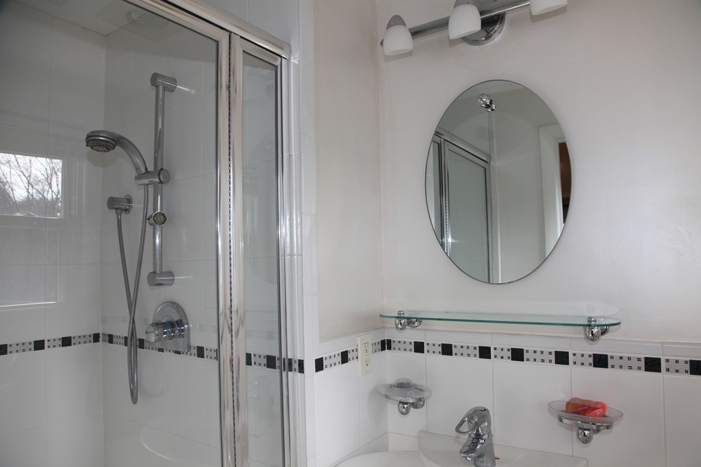 155 Noanett Road Needham, MA 02494 - Photo 6 of 18 a bathroom with a sink and a mirror