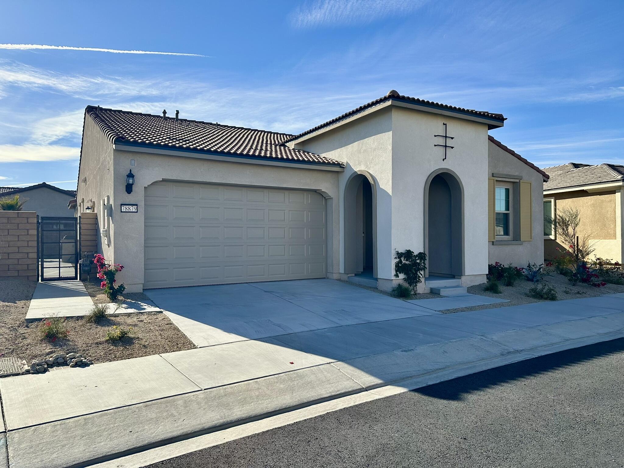 a front view of a house with garage