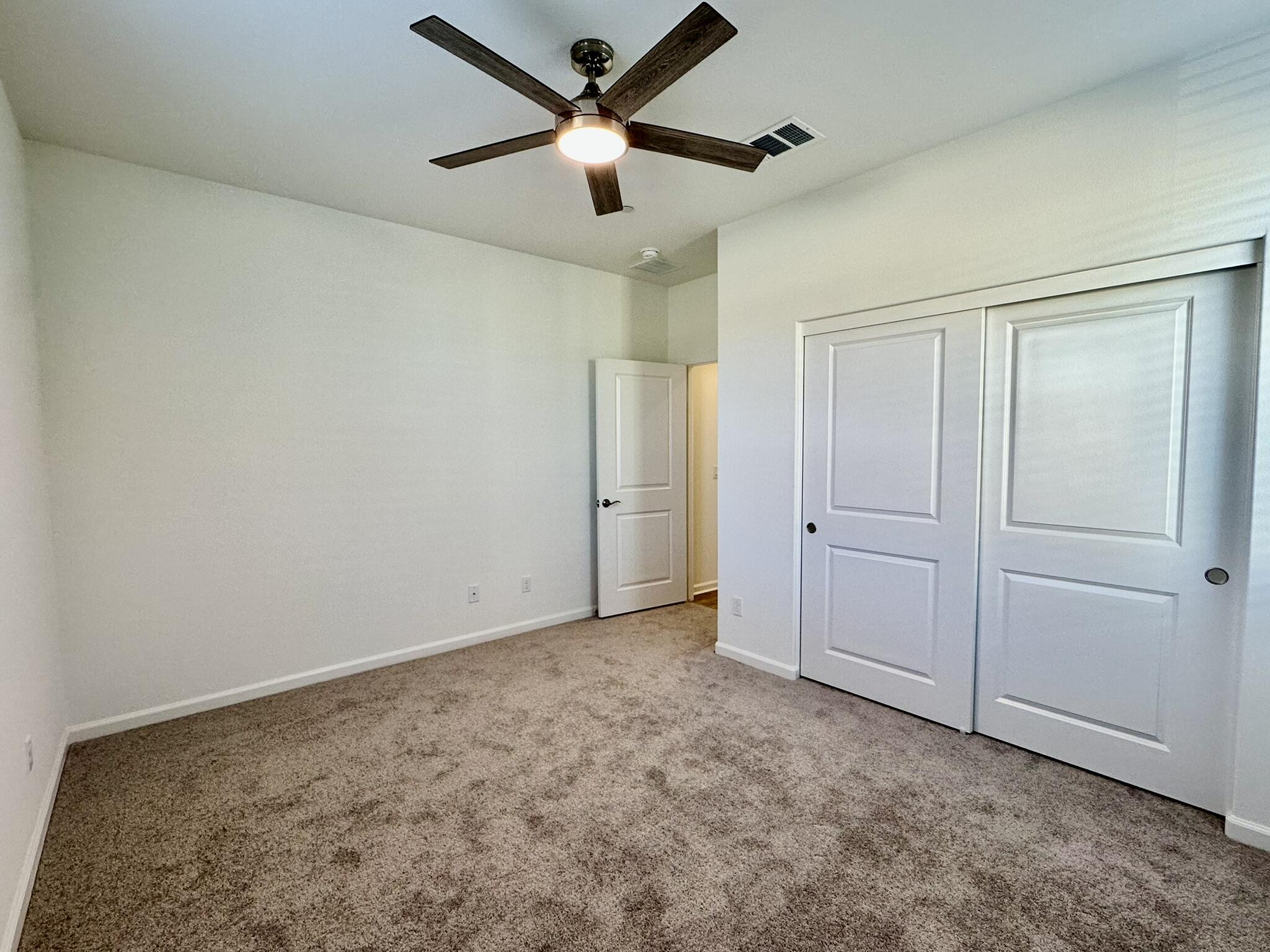 78879 Fortuna Place Palm Desert, CA 92211 - Photo 13 of 25 an empty room with closet and a ceiling fan