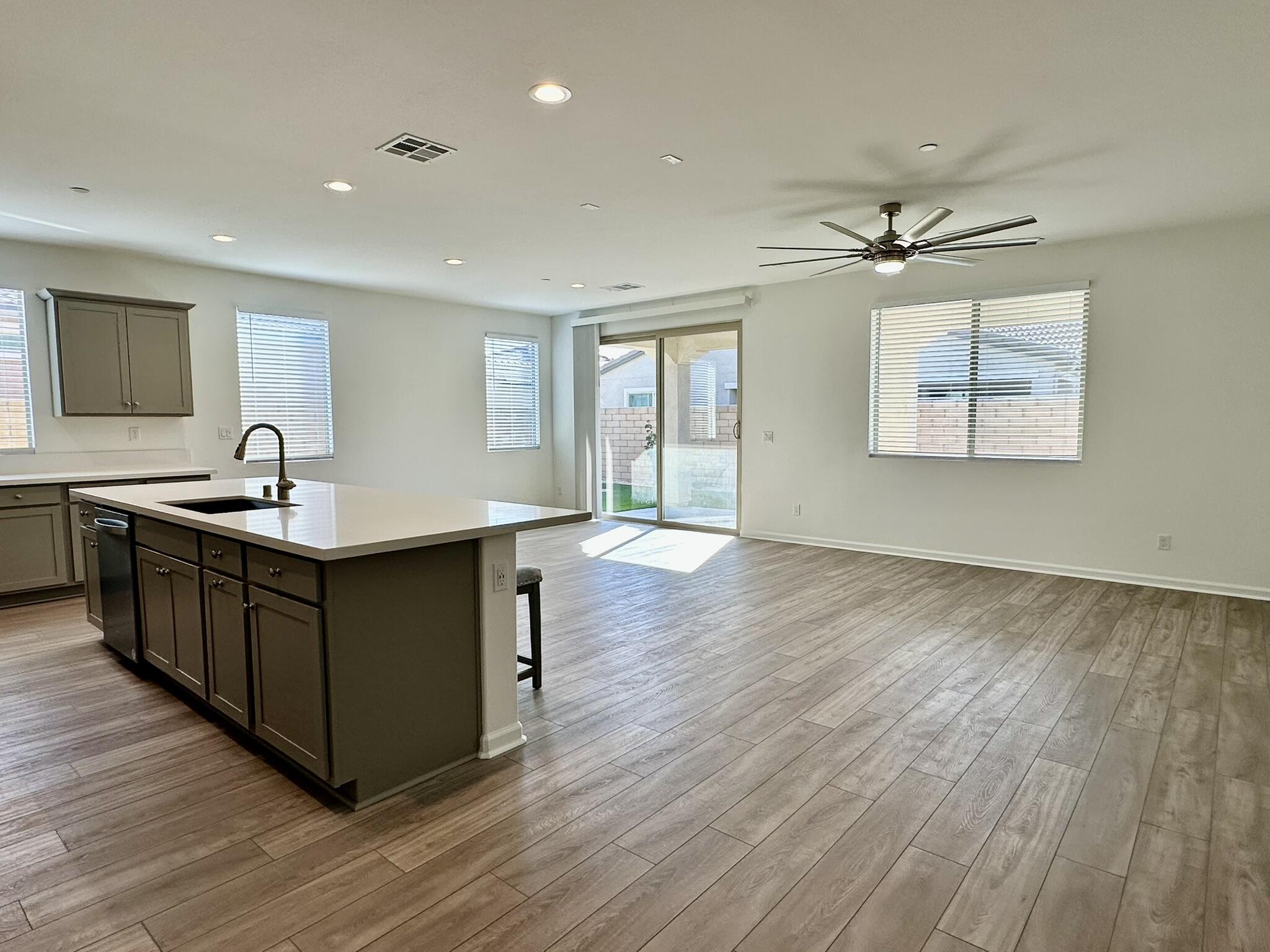 78879 Fortuna Place Palm Desert, CA 92211 - Photo 2 of 25 a kitchen with stainless steel appliances granite countertop a sink dishwasher a stove and a large refrigerator