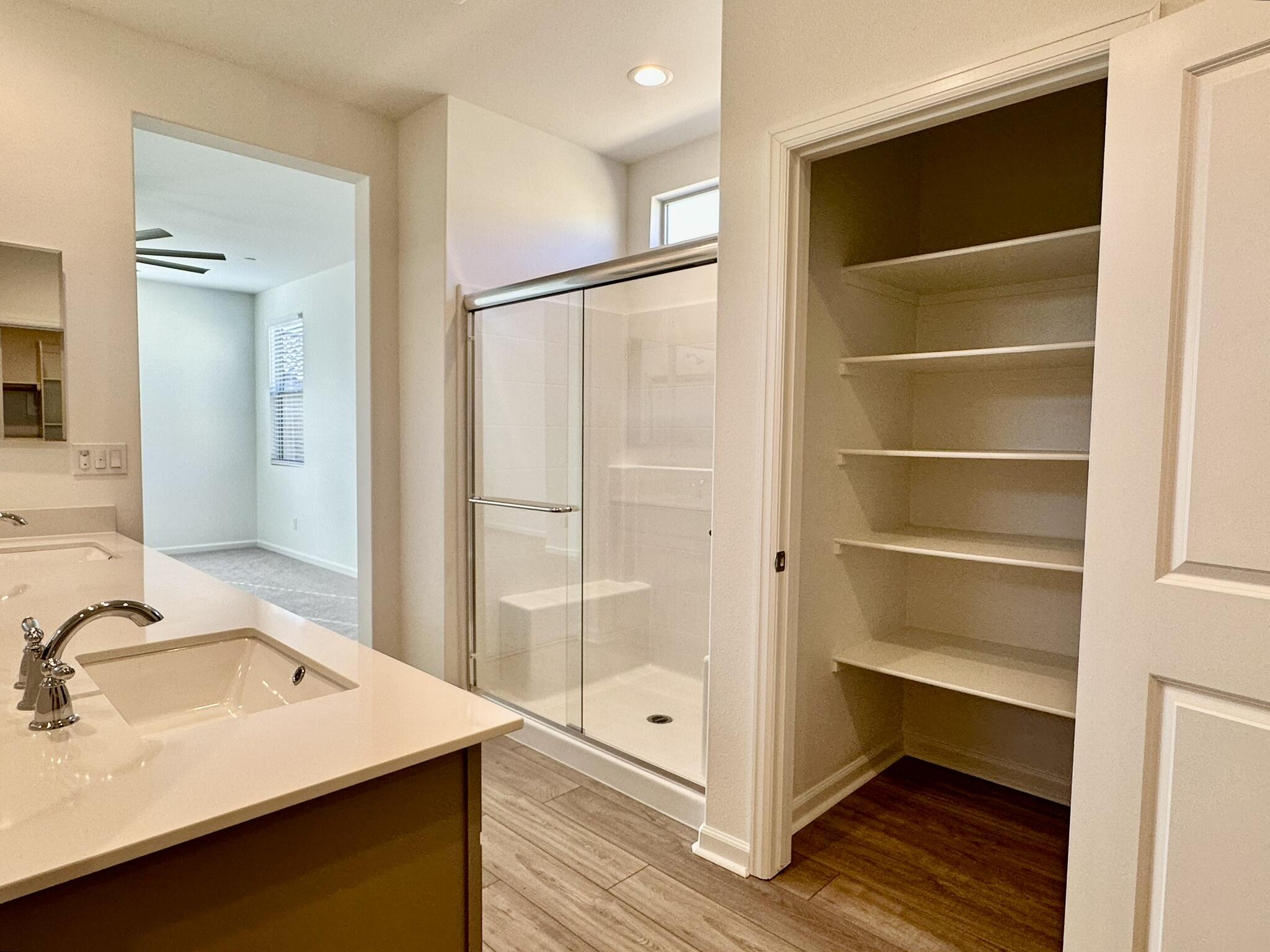 78879 Fortuna Place Palm Desert, CA 92211 - Photo 9 of 25 a view of a walk in closet and wooden floor