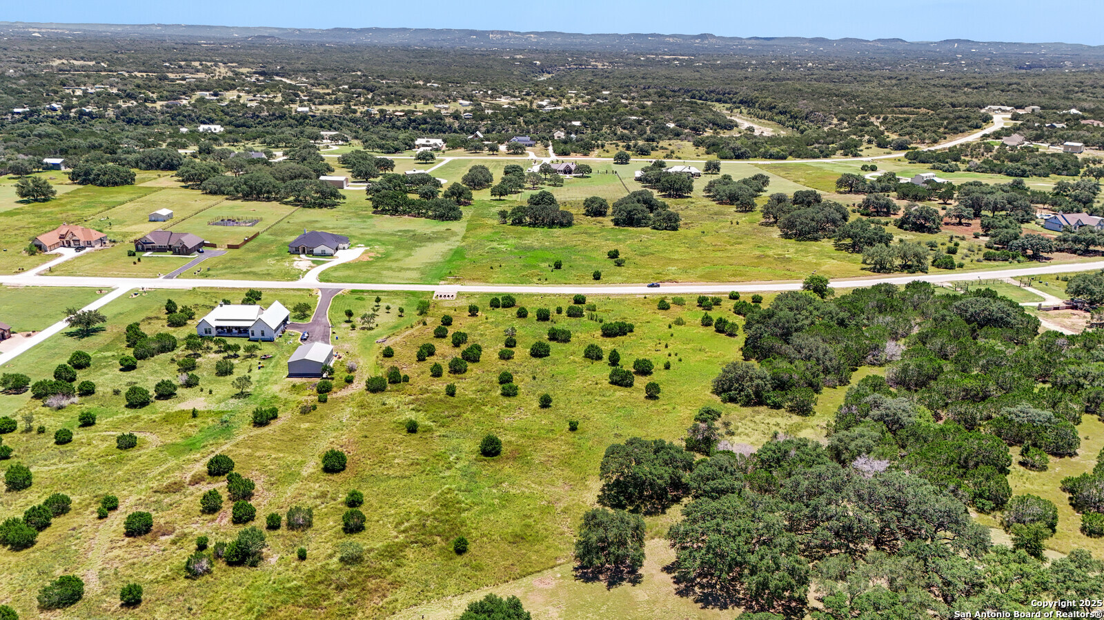 532 Buckskin Trail Bandera, TX 78003 - Photo 4 of 14 an aerial view of residential houses with outdoor space and trees