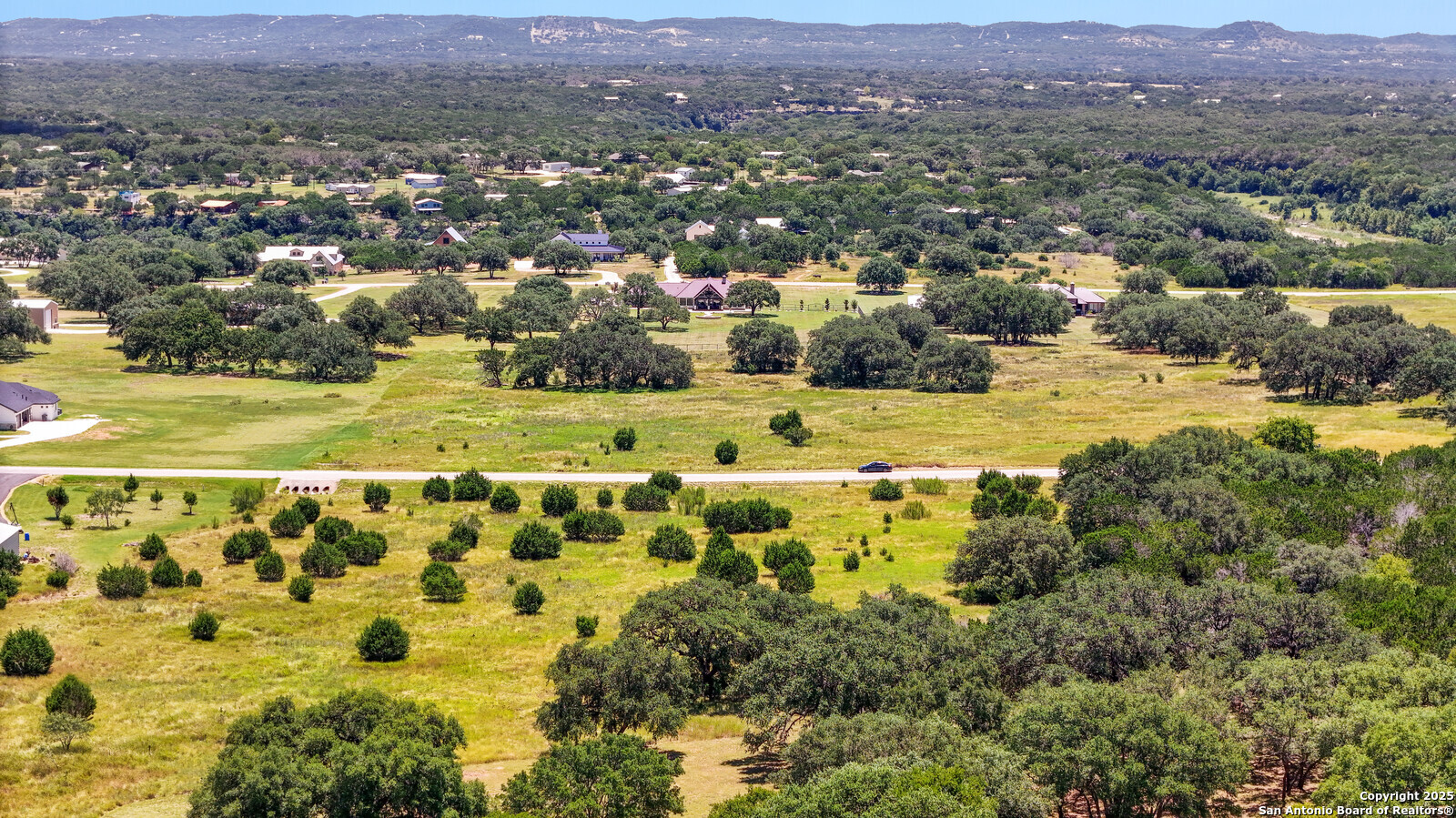 532 Buckskin Trail Bandera, TX 78003 - Photo 5 of 14 an aerial view of residential houses with outdoor space and trees