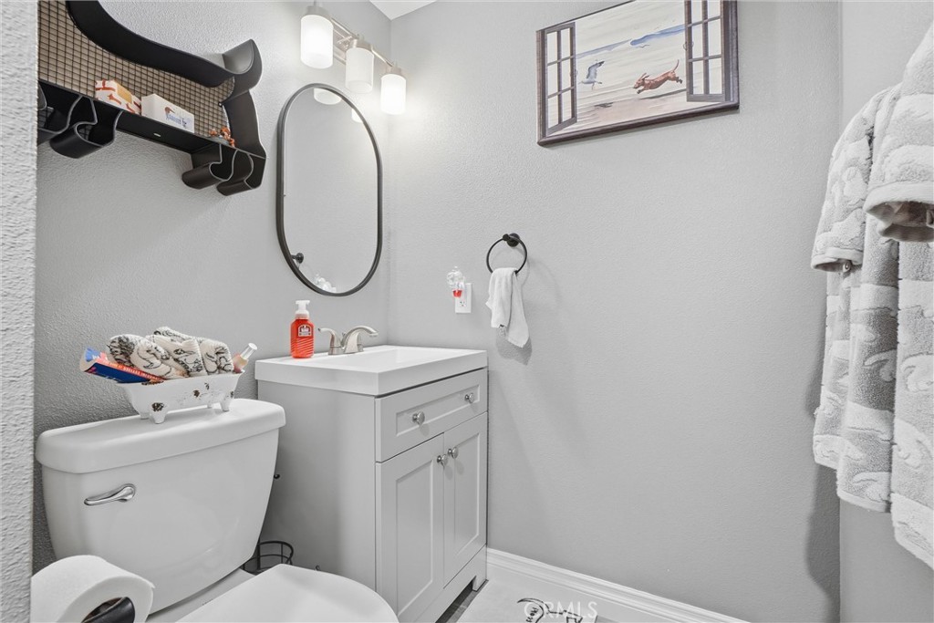 904 Cornwall Drive Anaheim, CA 92804 - Photo 12 of 42 a bathroom with a sink mirror and toilet