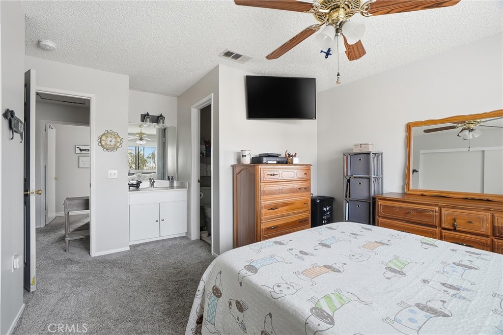 904 Cornwall Drive Anaheim, CA 92804 - Photo 15 of 41 a bedroom with a bed and a flat screen tv