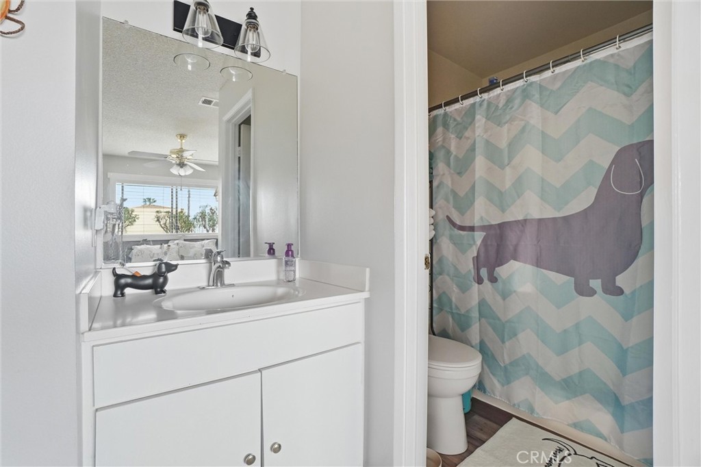 904 Cornwall Drive Anaheim, CA 92804 - Photo 17 of 41 a bathroom with a sink mirror vanity and toilet