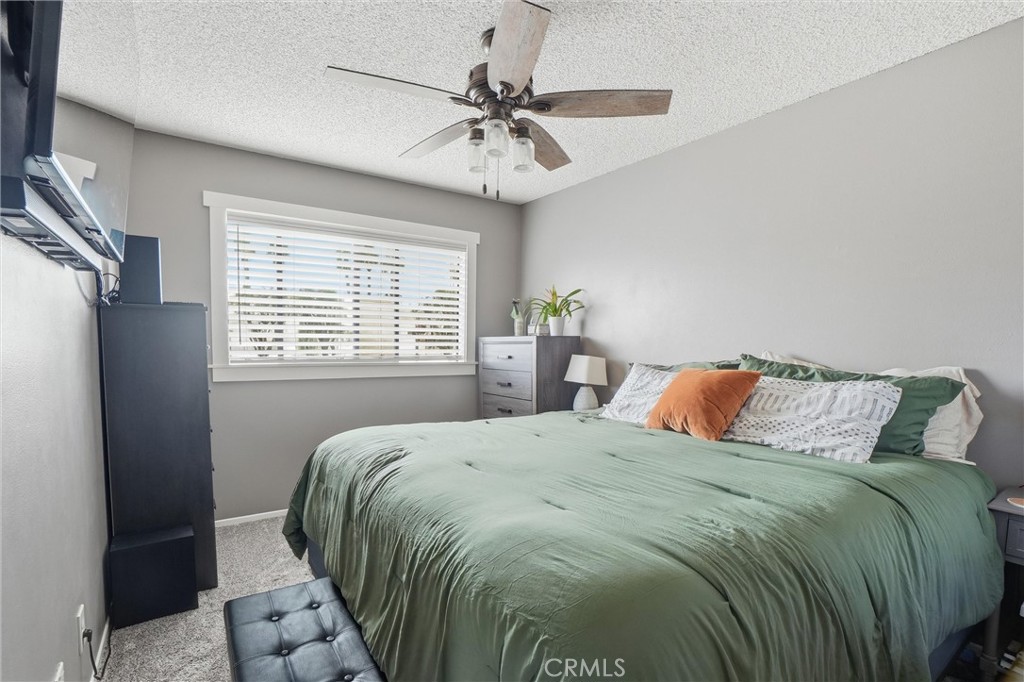 904 Cornwall Drive Anaheim, CA 92804 - Photo 18 of 41 a bedroom with a bed and a table