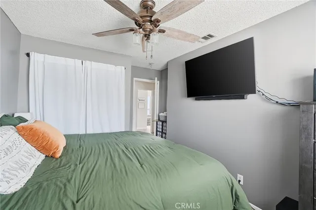 a bedroom with a bed and a table