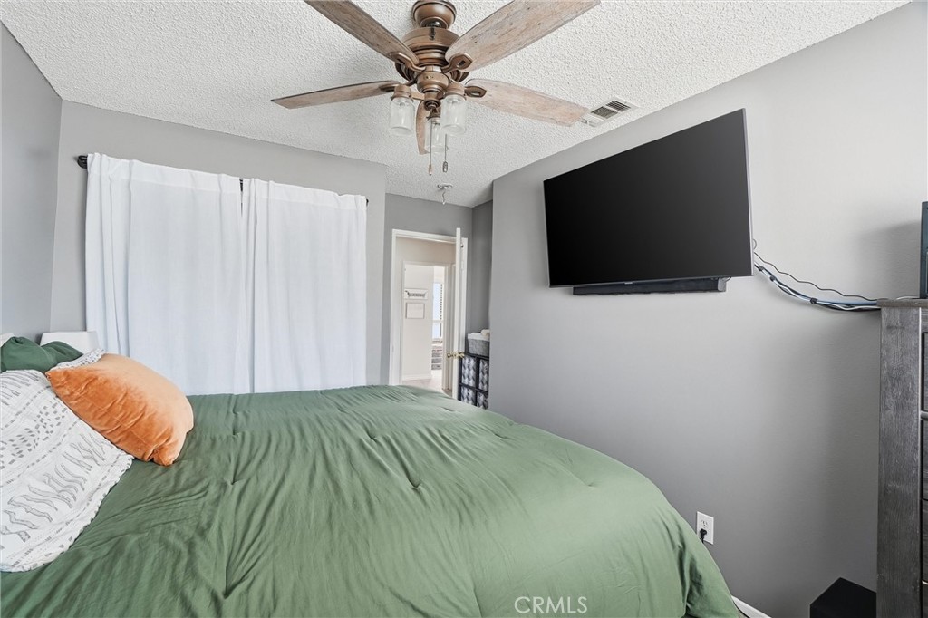 904 Cornwall Drive Anaheim, CA 92804 - Photo 19 of 41 a bedroom with a bed and a flat screen tv