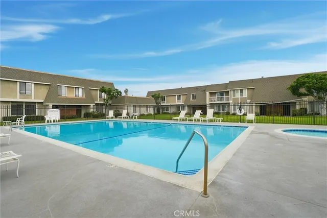 a view of a patio with a table and chairs