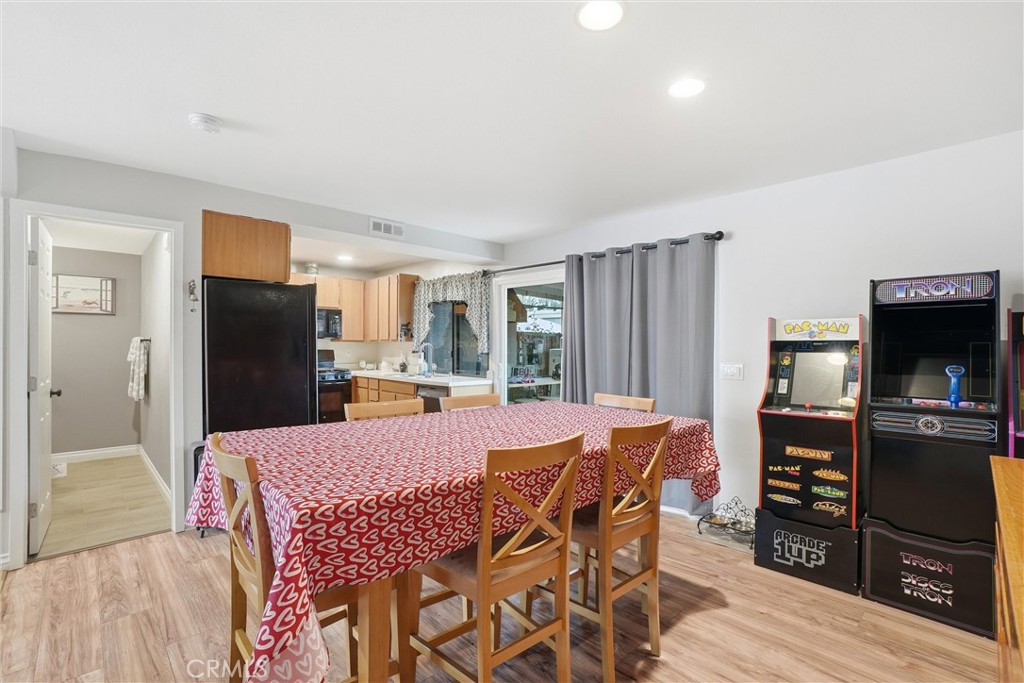 904 Cornwall Drive Anaheim, CA 92804 - Photo 7 of 41 a view of a dining room with furniture and a kitchen