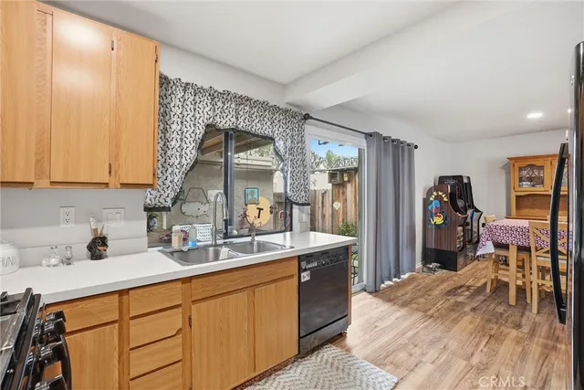 a kitchen with stainless steel appliances granite countertop a refrigerator stove and sink