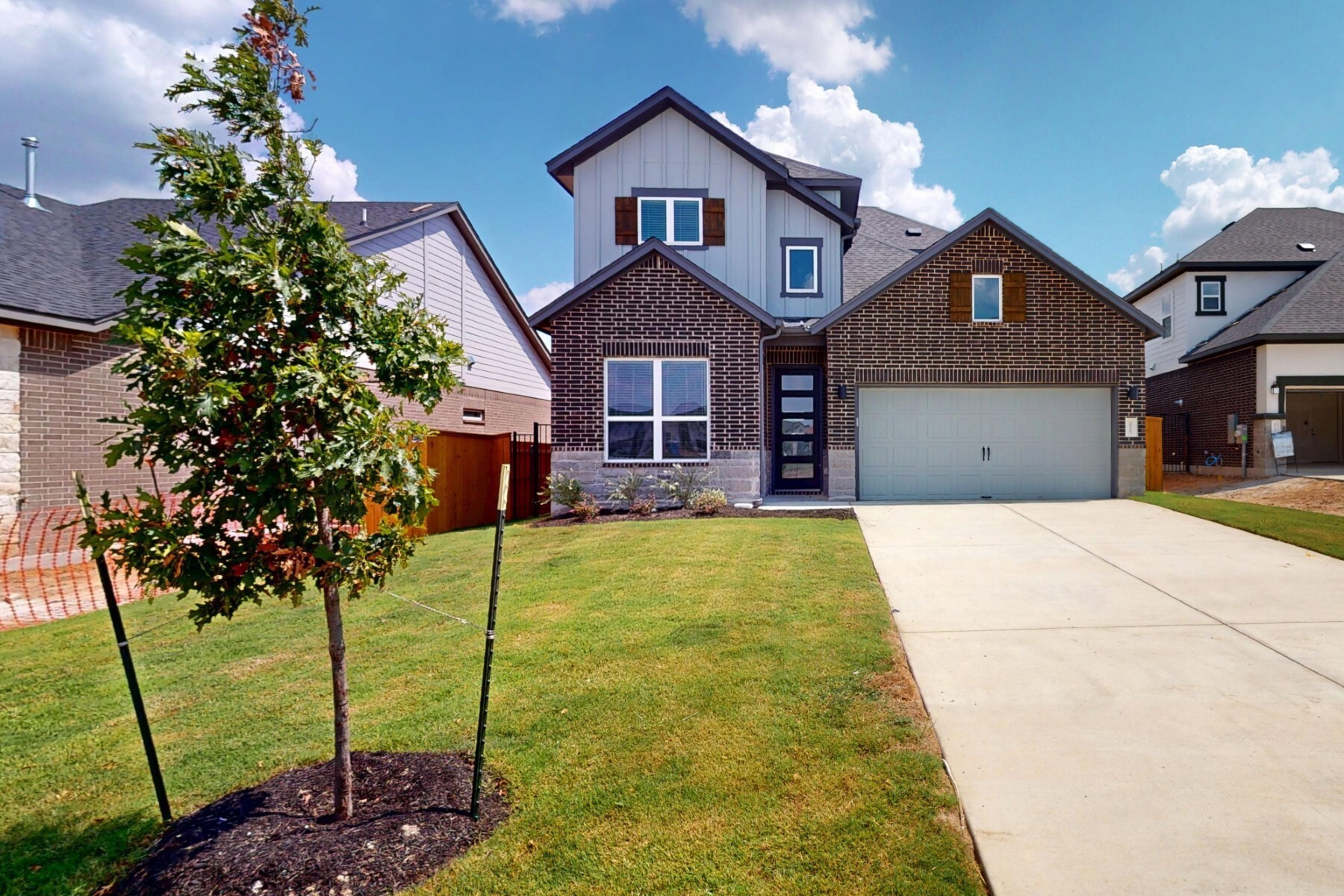 20117 Aqua Reef Drive Austin, TX 78747 - Photo 1 of 40 a front view of a house with a garden