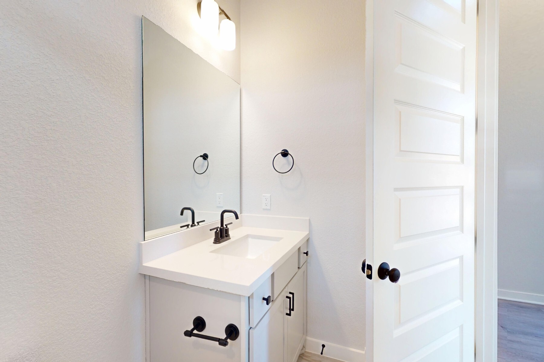 20117 Aqua Reef Drive Austin, TX 78747 - Photo 21 of 40 a bathroom with a sink and a mirror