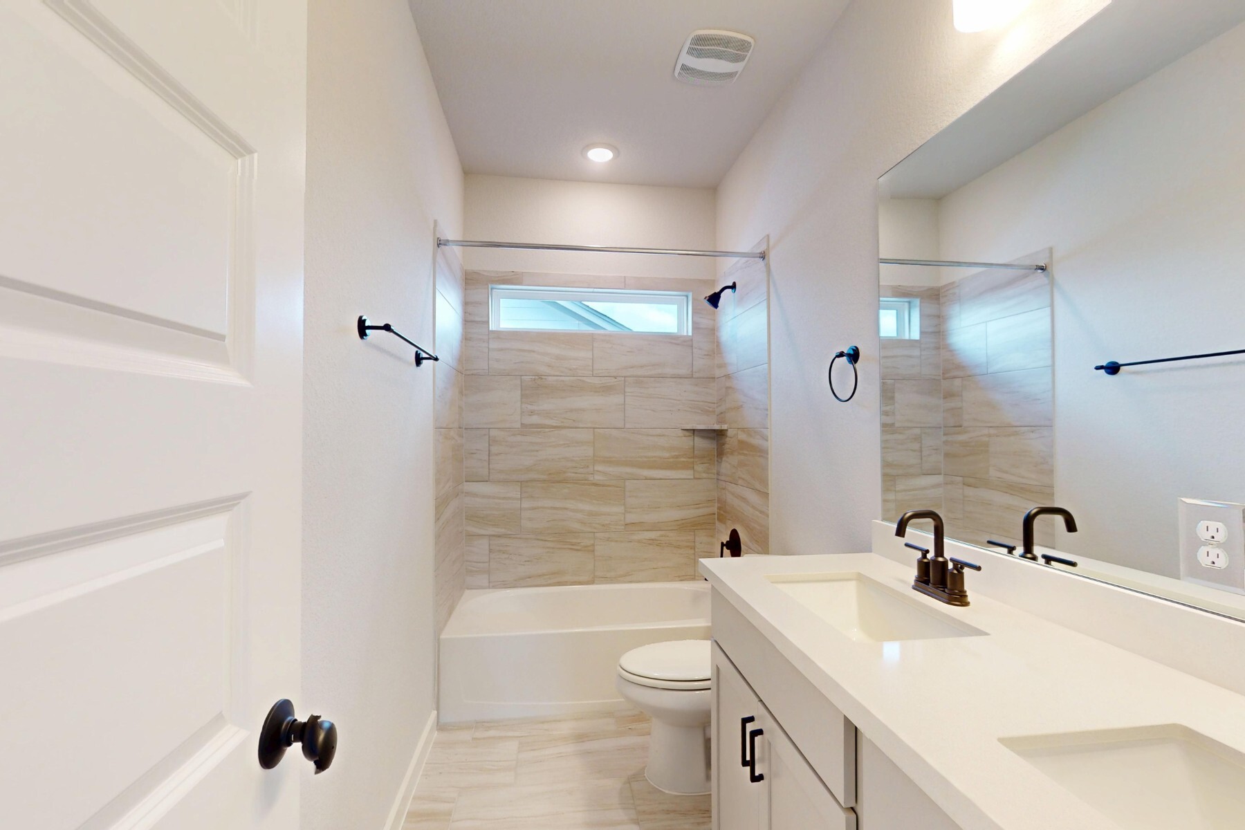 20117 Aqua Reef Drive Austin, TX 78747 - Photo 22 of 40 a bathroom with a sink a toilet and shower