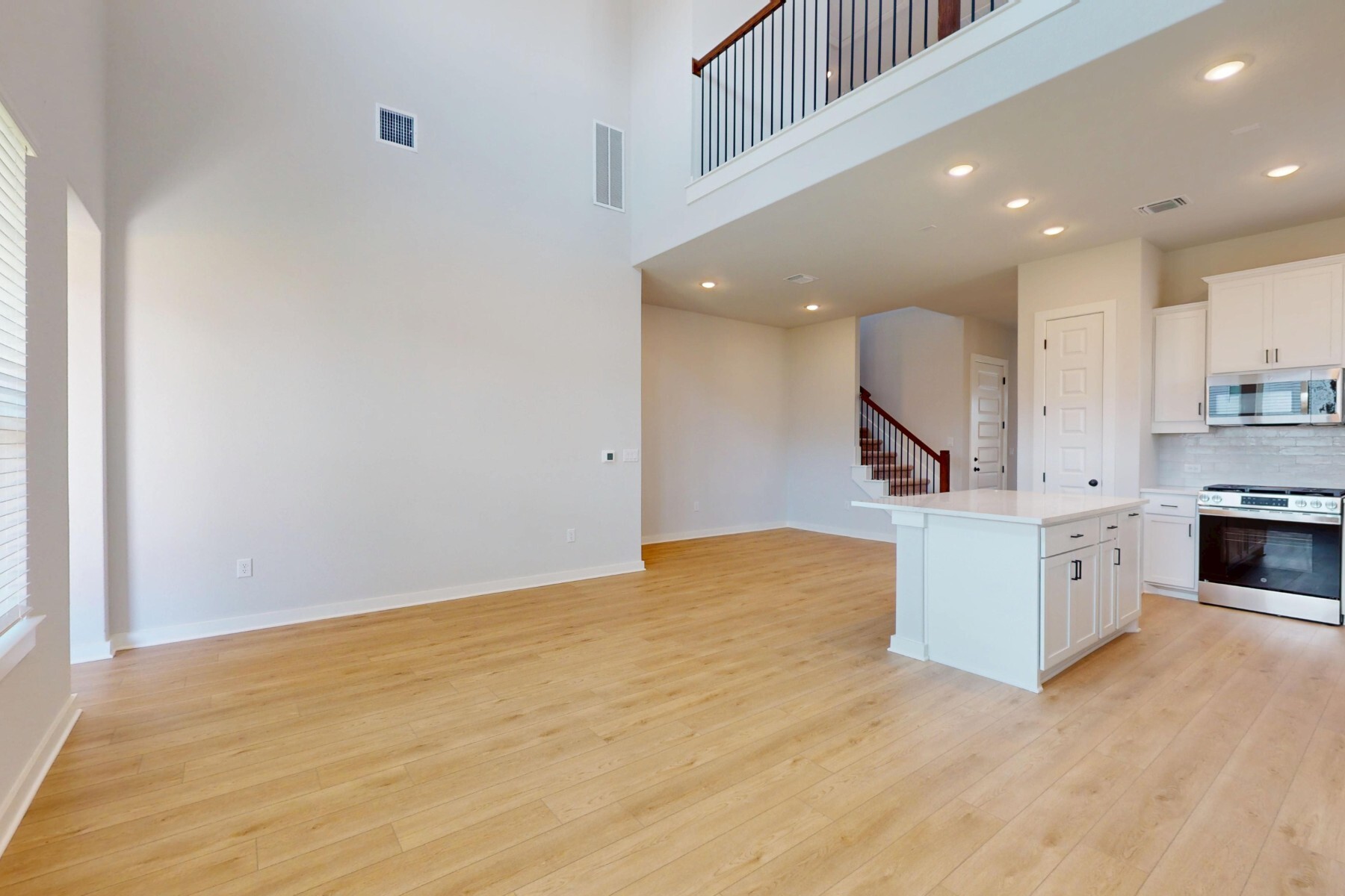 20117 Aqua Reef Drive Austin, TX 78747 - Photo 5 of 40 a view of kitchen with wooden floor and electronic appliances